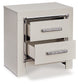 Zyniden Queen Upholstered Panel Headboard with Mirrored Dresser, Chest and Nightstand